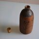 Bottle vase decorative flowers ceramic signature with fish to identify.