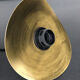 Mid-curved brass suspension