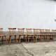 Set of 8 vintage bistro chairs – Warm stained wood – Compass legs