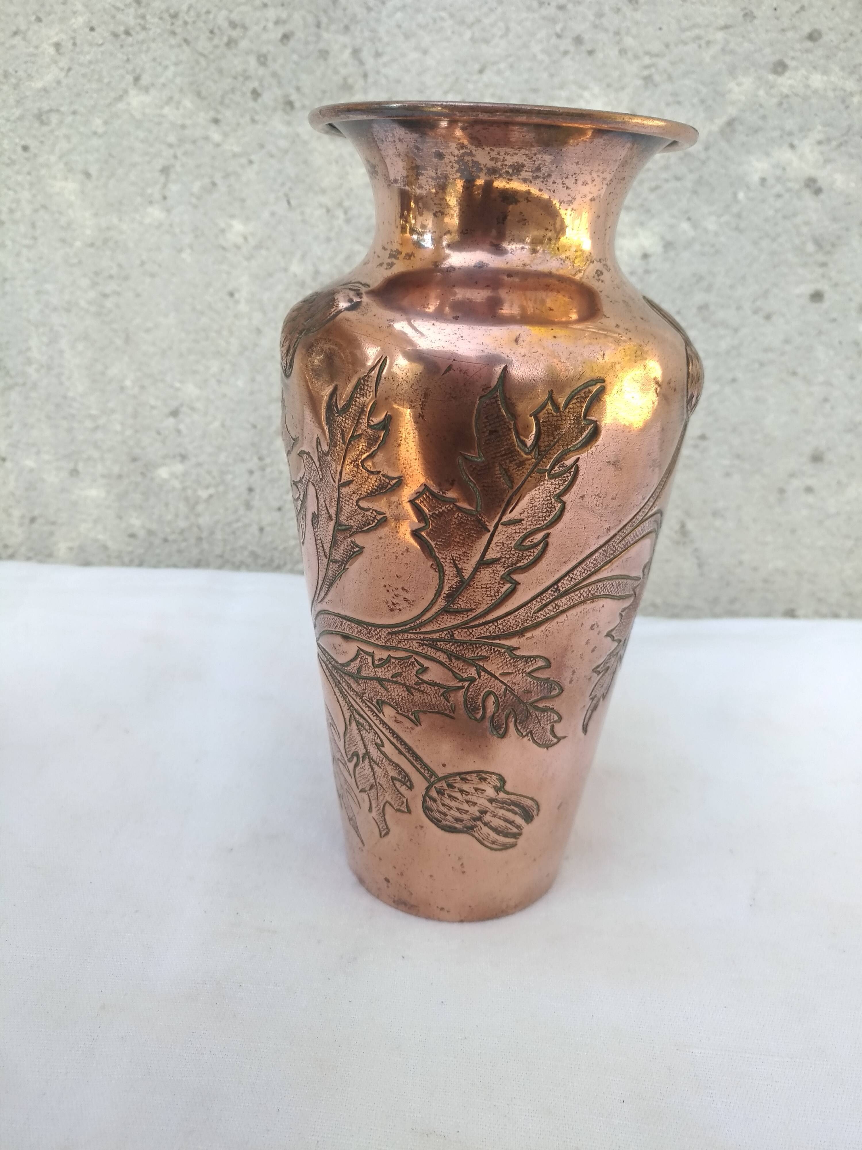 Repulsed copper vase