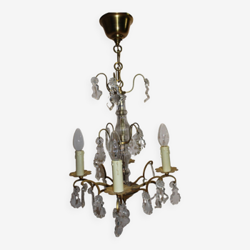 antique brass chandelier with baroque style pendants