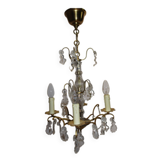 antique brass chandelier with baroque style pendants