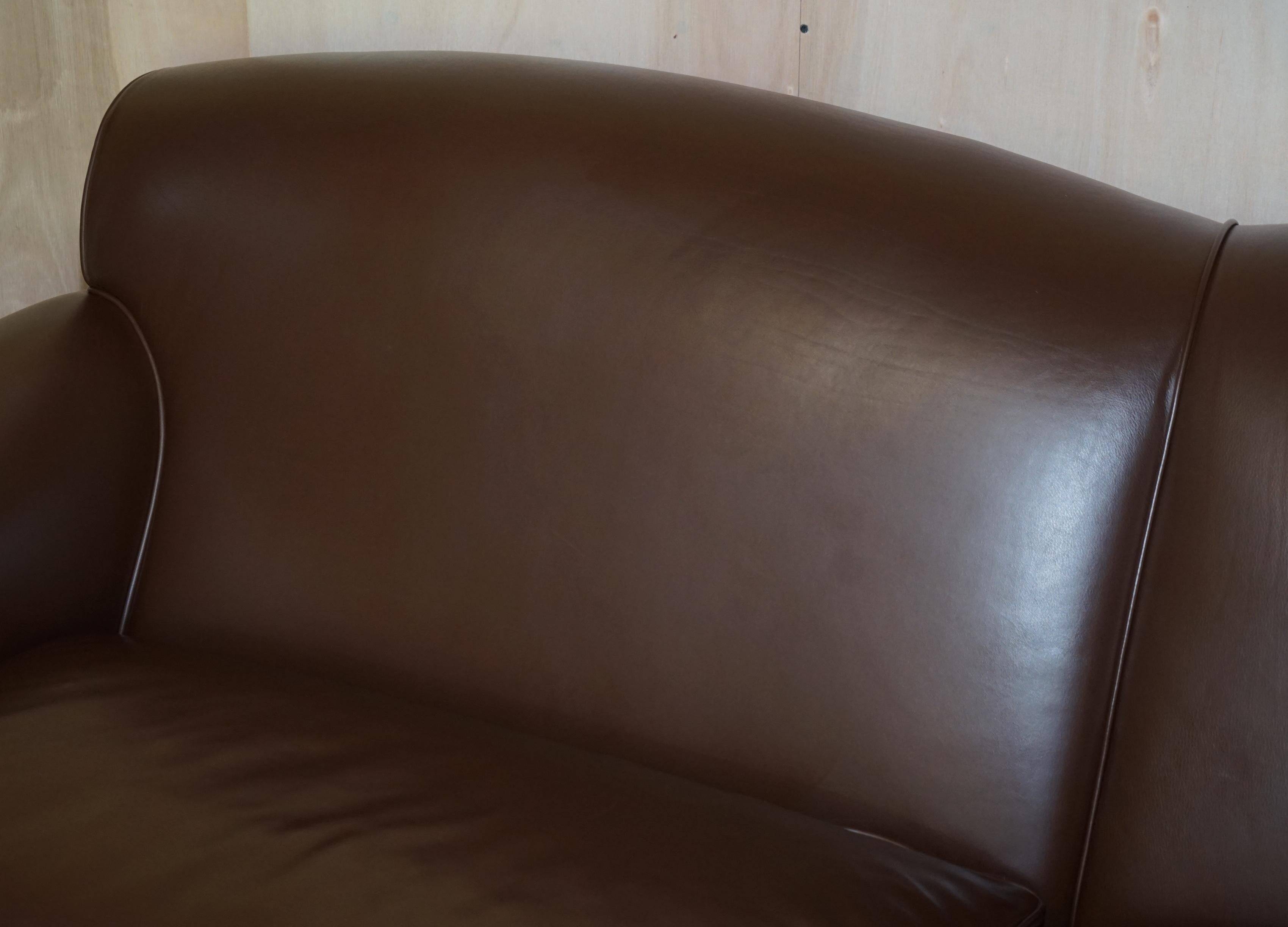 Contemporary Howard & Sons style grand sofa with brass casters.