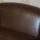 Contemporary Howard & Sons style grand sofa with brass casters.