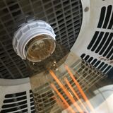 Vintage hairdresser's armchair with helmet transformed into a lamp