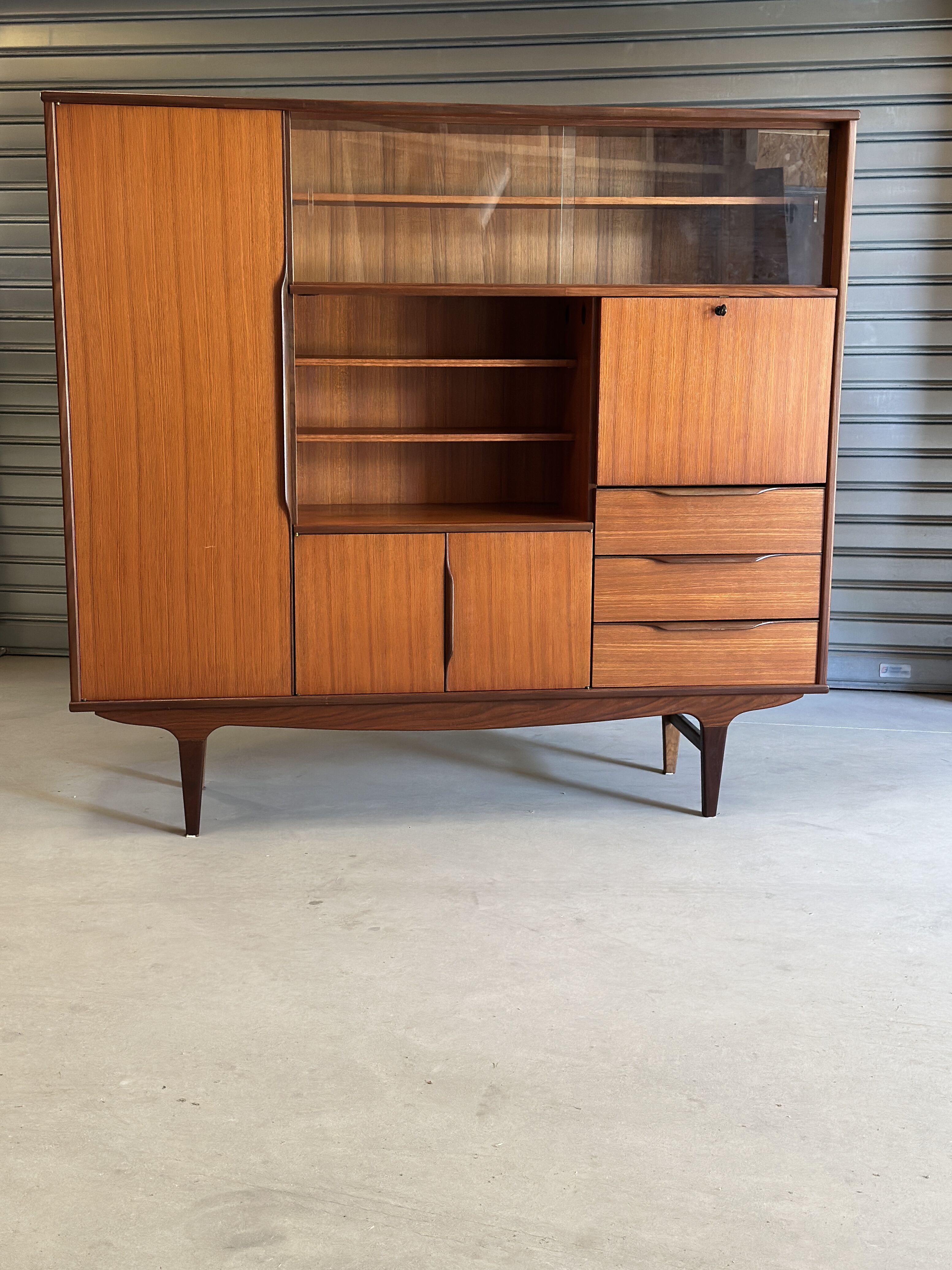 Very beautiful Scandinavian highboard in teak from the 1960s.