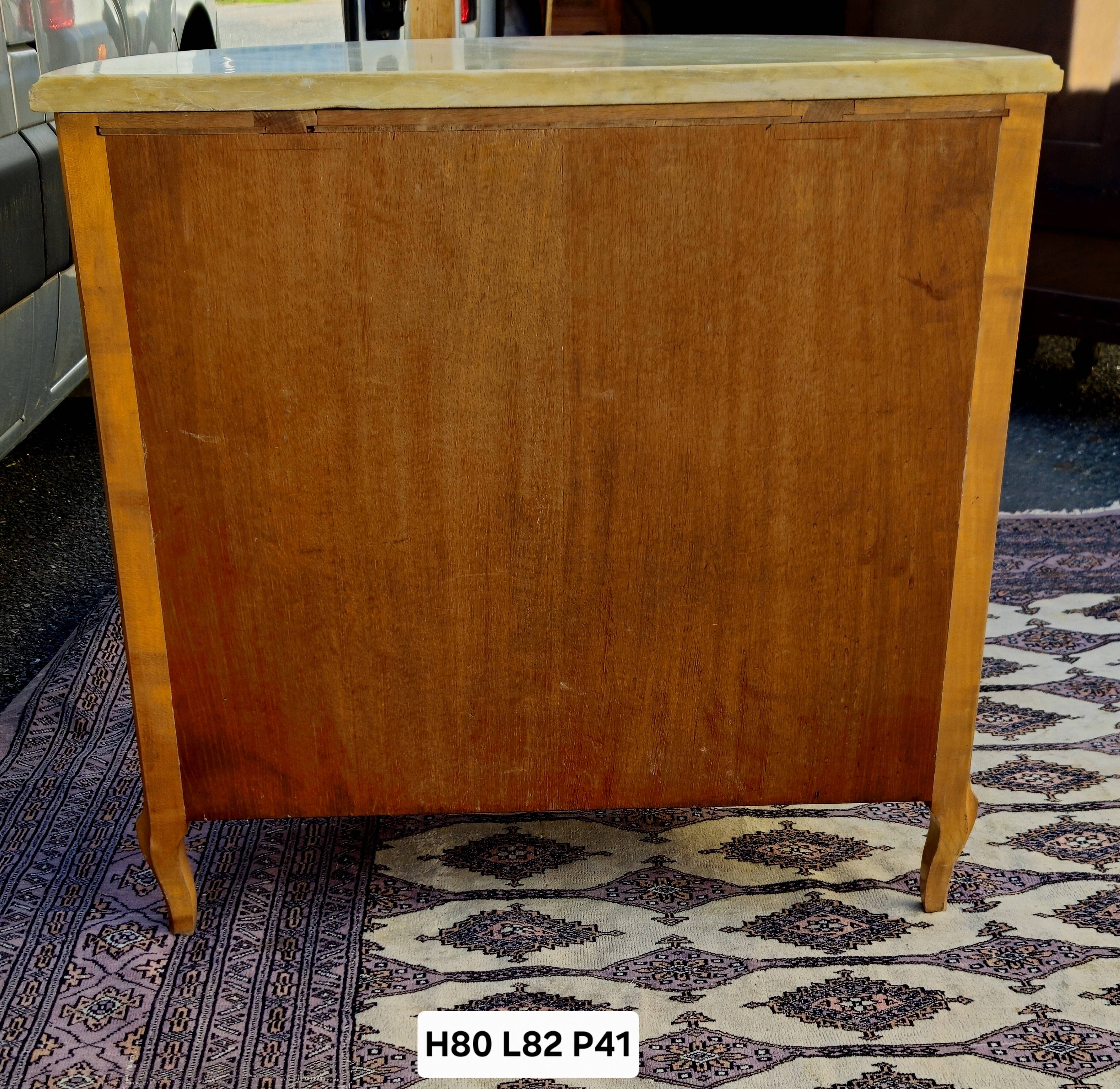 Half-moon commode in burl wood with a marble top.