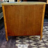 Half-moon commode in burl wood with a marble top.
