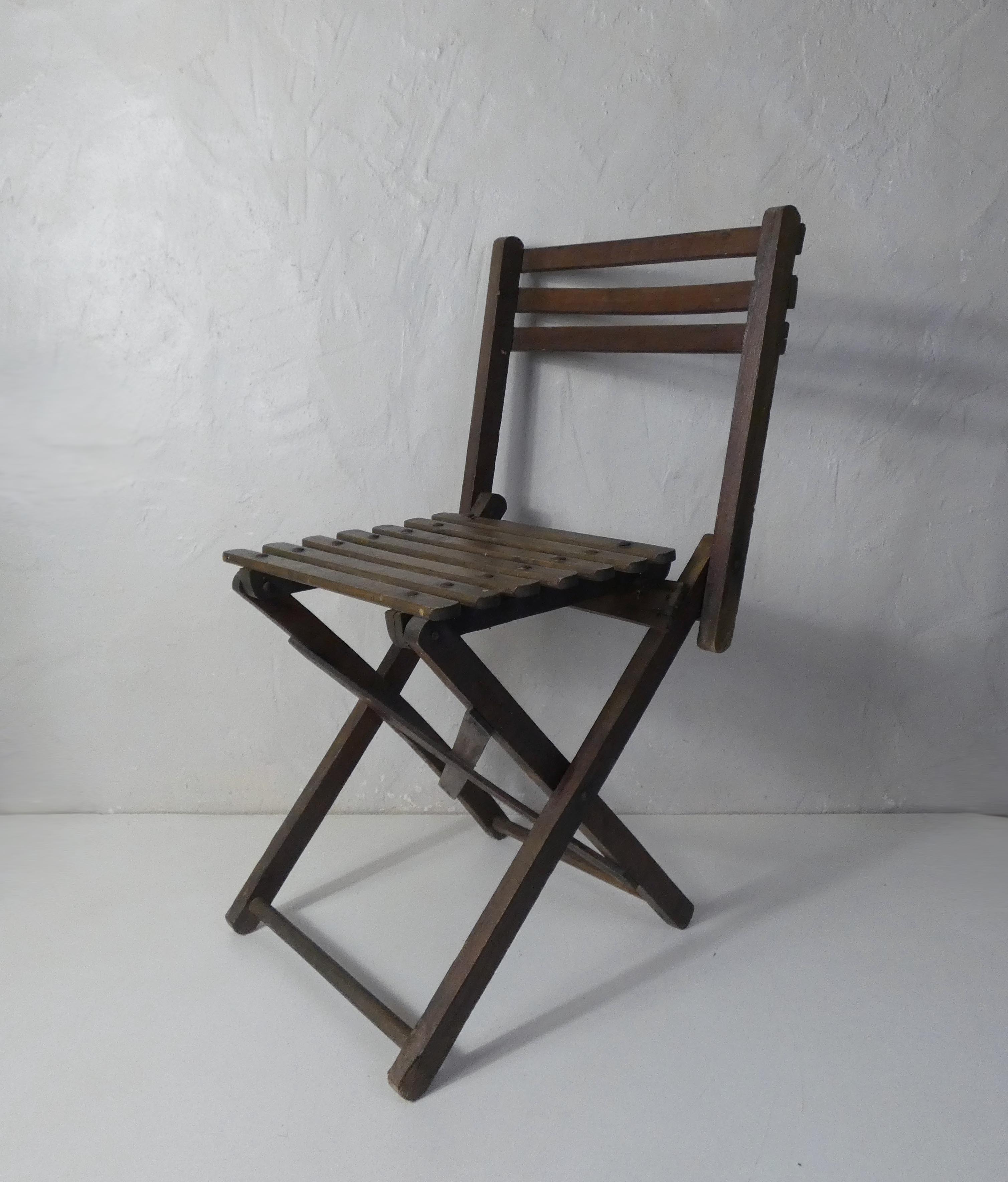 Old folding wooden chair for children