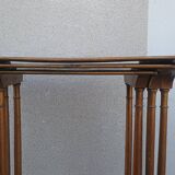 Sets of three nesting tables with painted landscape decorations in poplar.