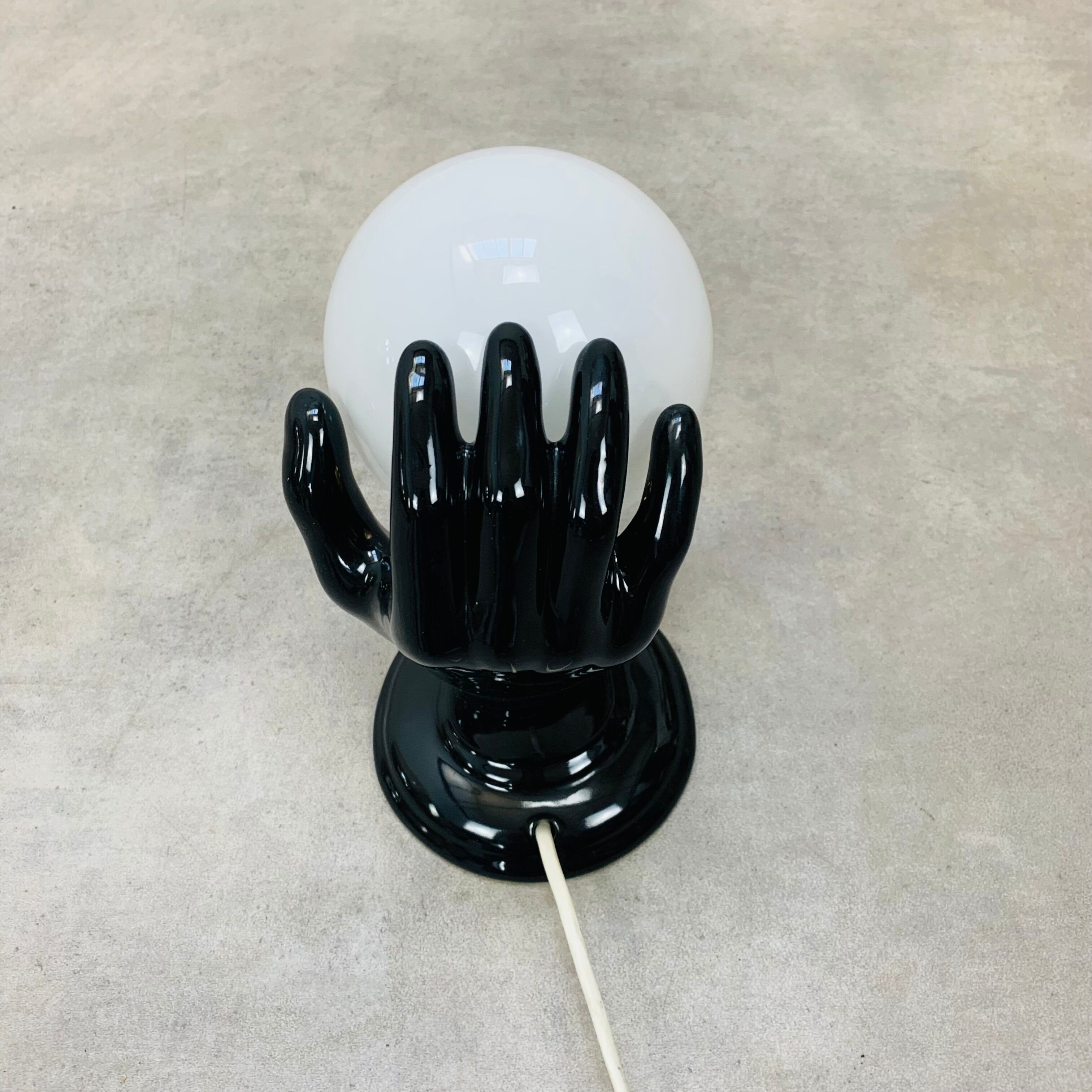 Black and opaline ceramic hand lamp