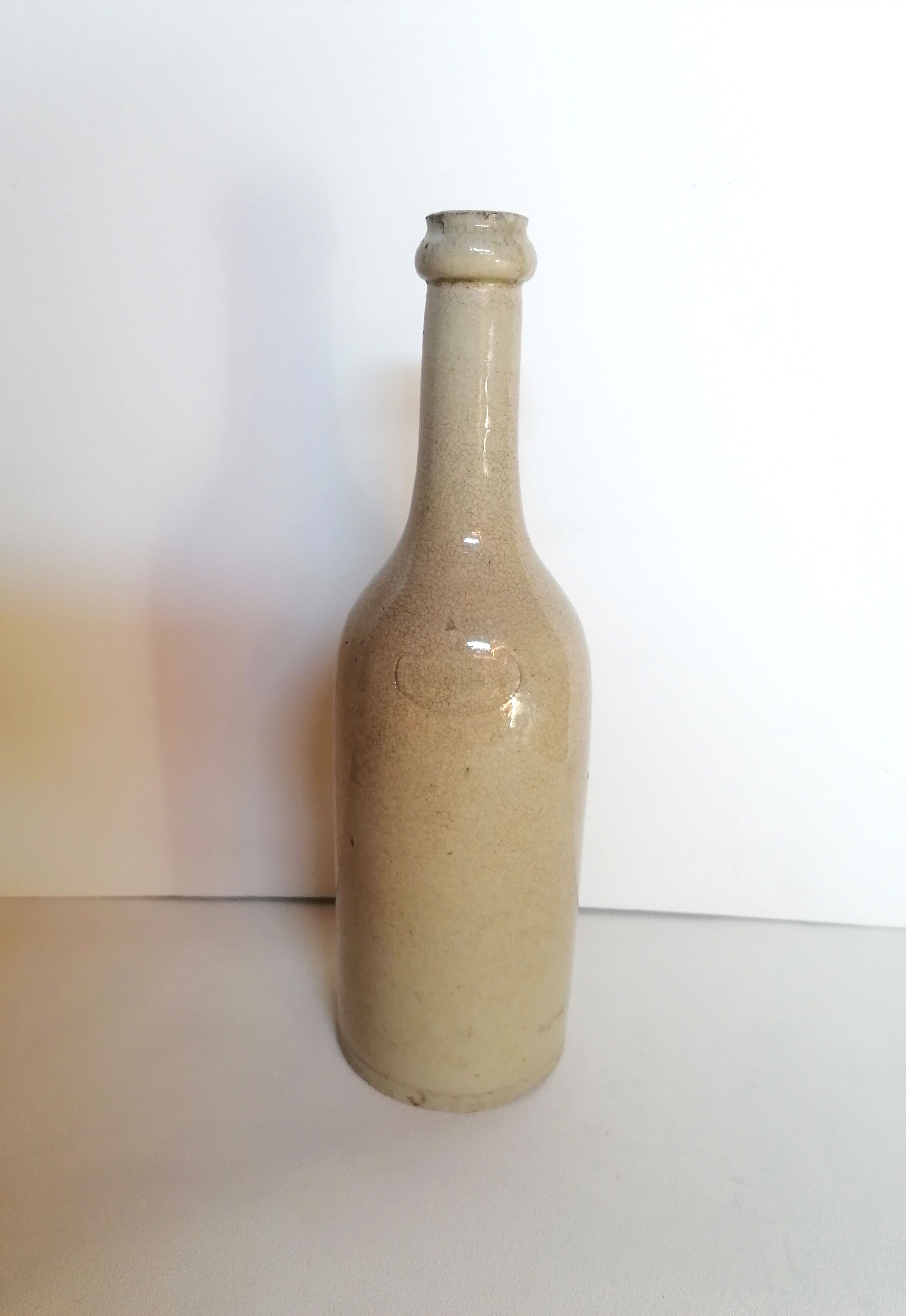 Cracked enamelled sandstone bottle