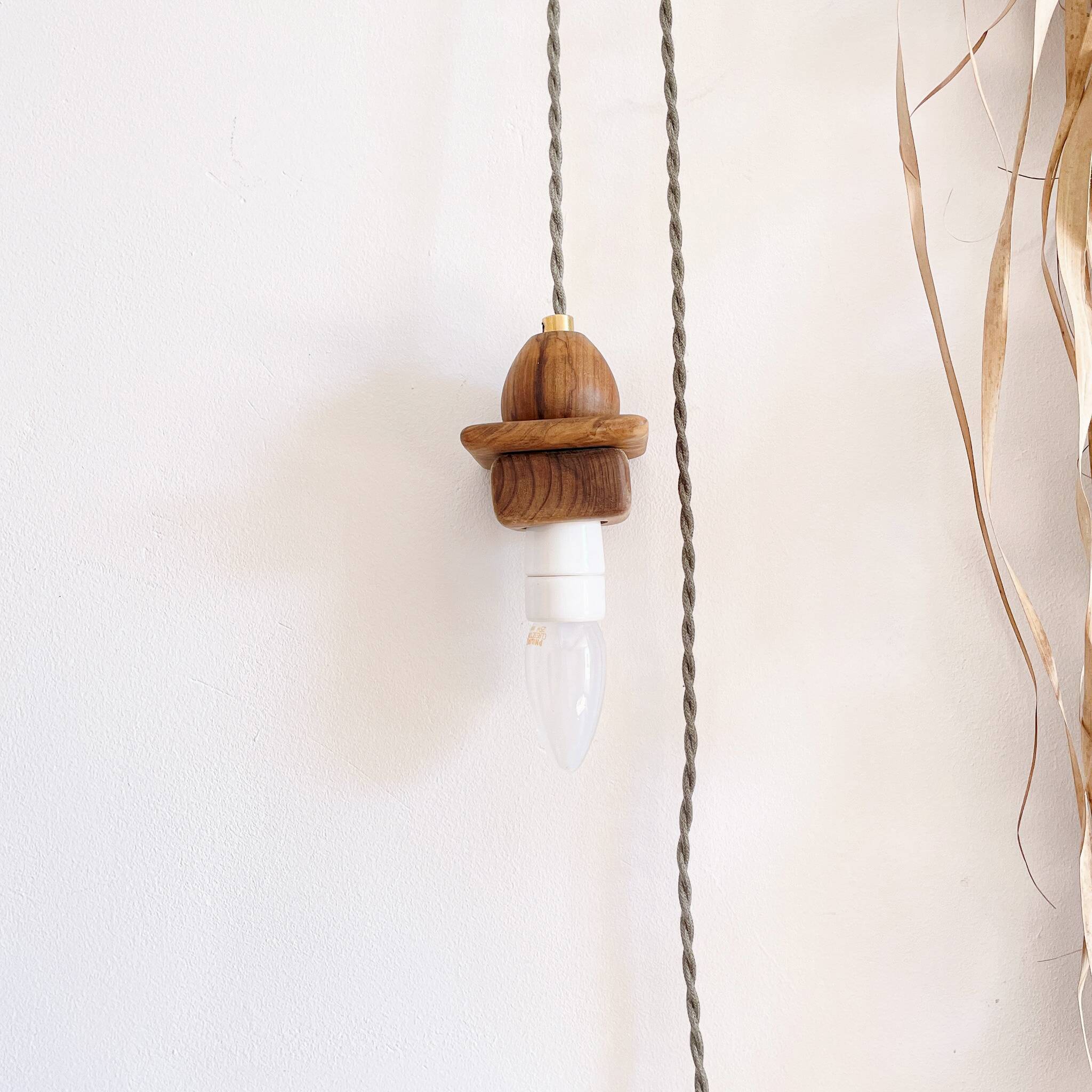 Wooden portable lamp with green cable