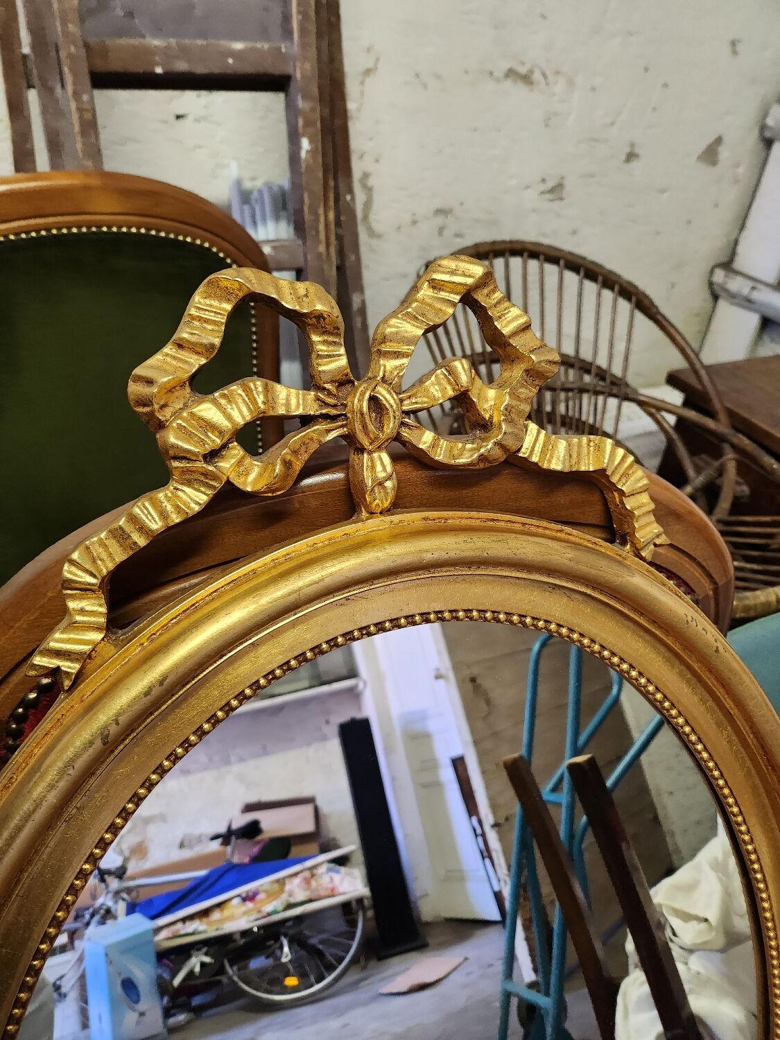 Vintage oval bow tie mirror