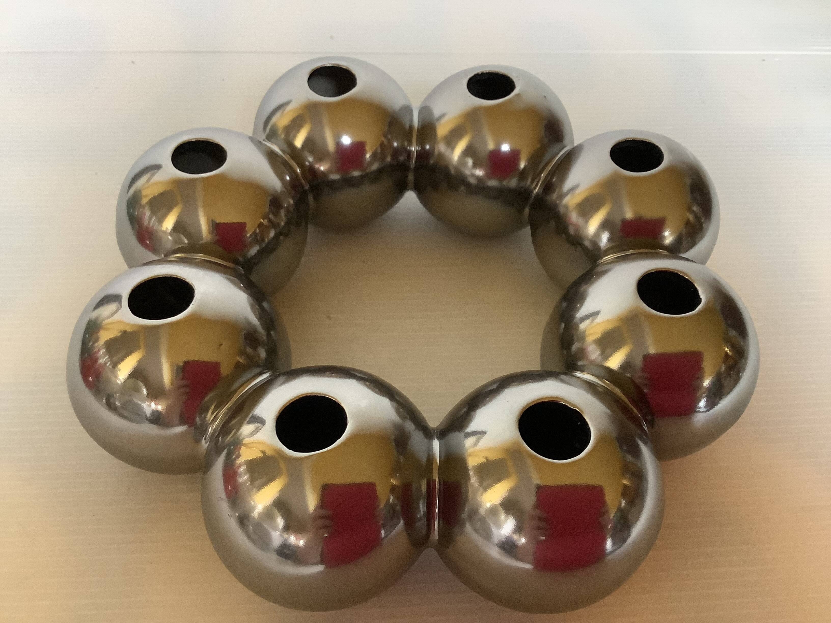 Silver flower vase in a crown shape.