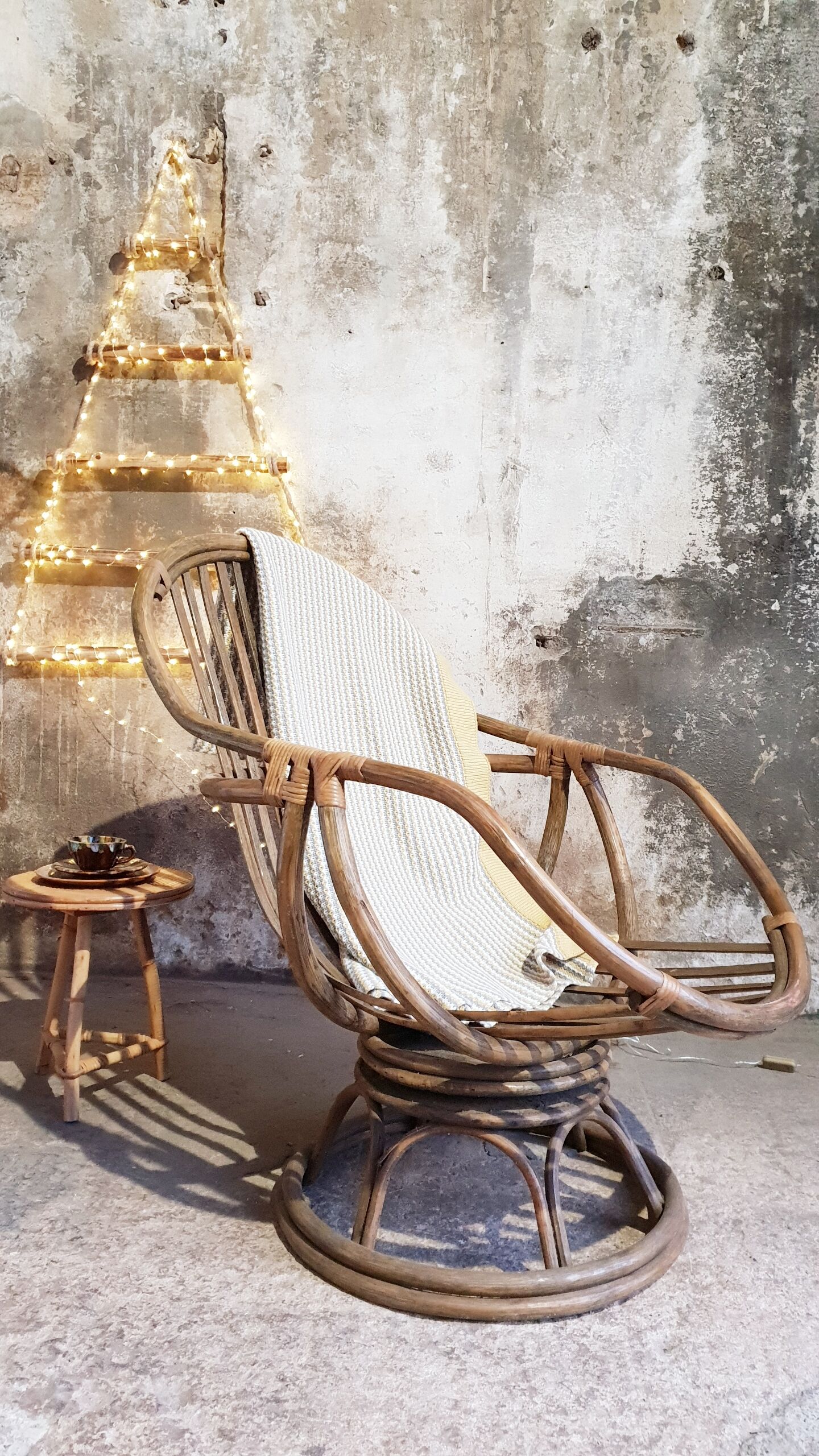 Antique swivel rattan armchair