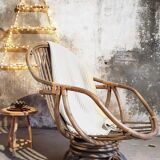Antique swivel rattan armchair