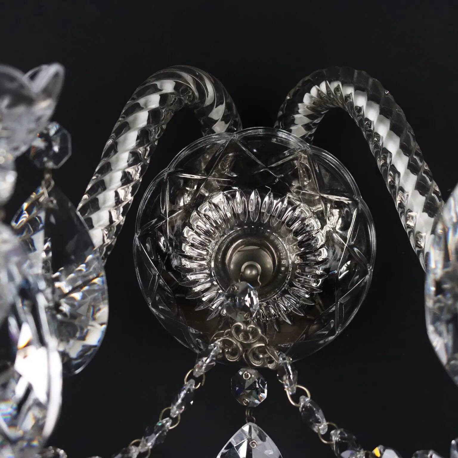 Antique wall light with 2 lights from the 1900s, featuring crystal bobeches and pendants.