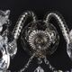 Antique wall light with 2 lights from the 1900s, featuring crystal bobeches and pendants.