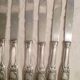12 couteaux de table en metal argente modele "feuillages" lames inox
