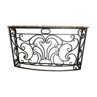 Forged iron console and pink marble