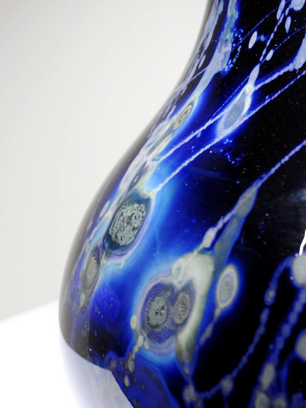 Large vintage purple art glass vase with silver glitter inclusions.