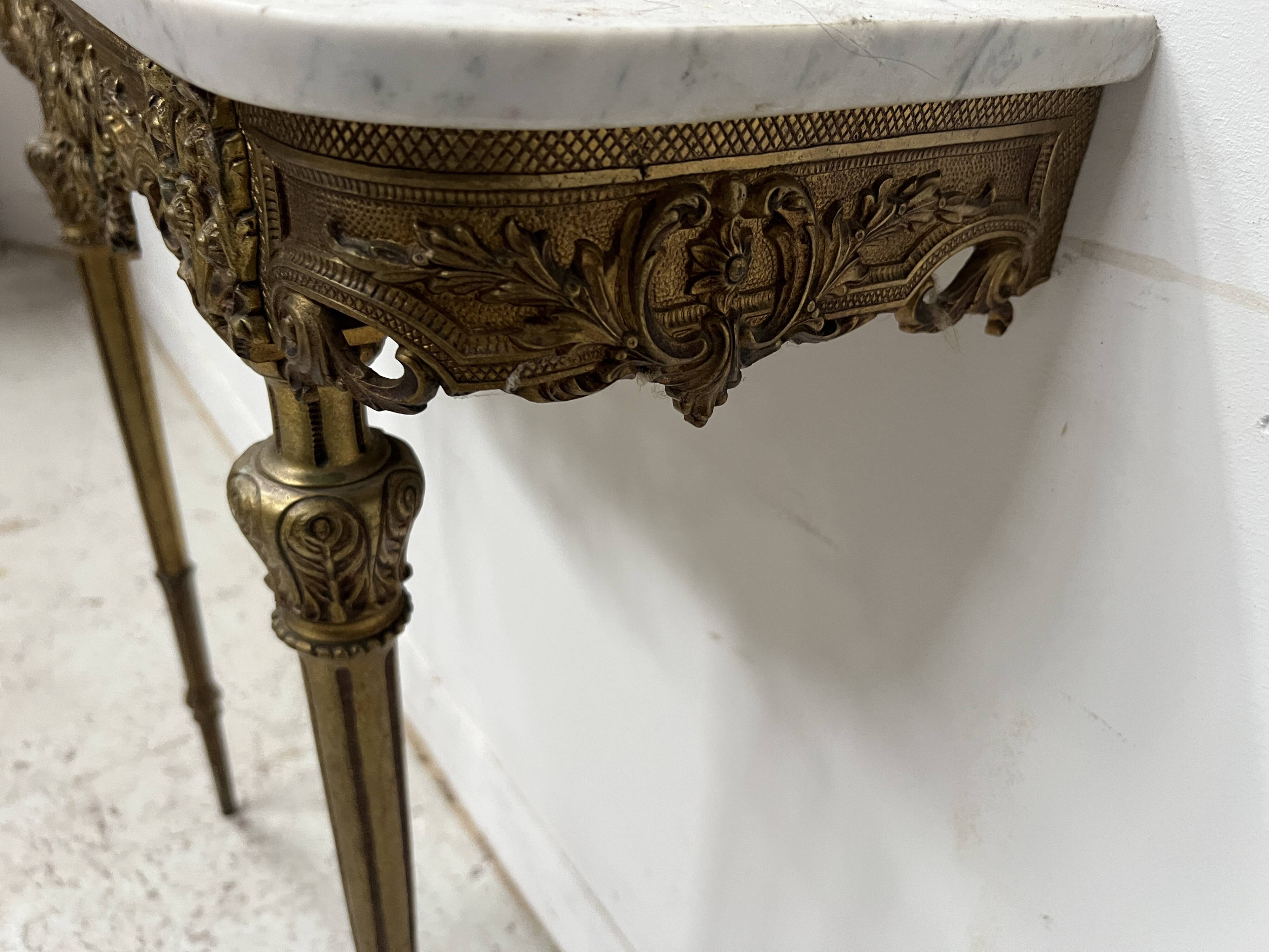 Louis XVI style console in chiselled bronze, 20th century.