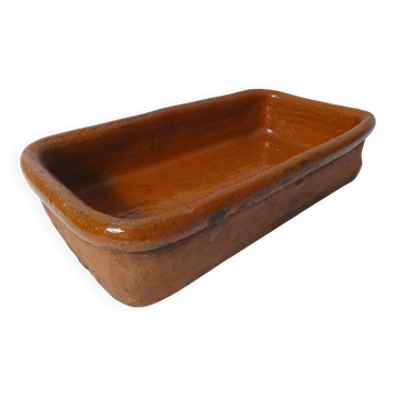 old glazed refractory terracotta baking dish