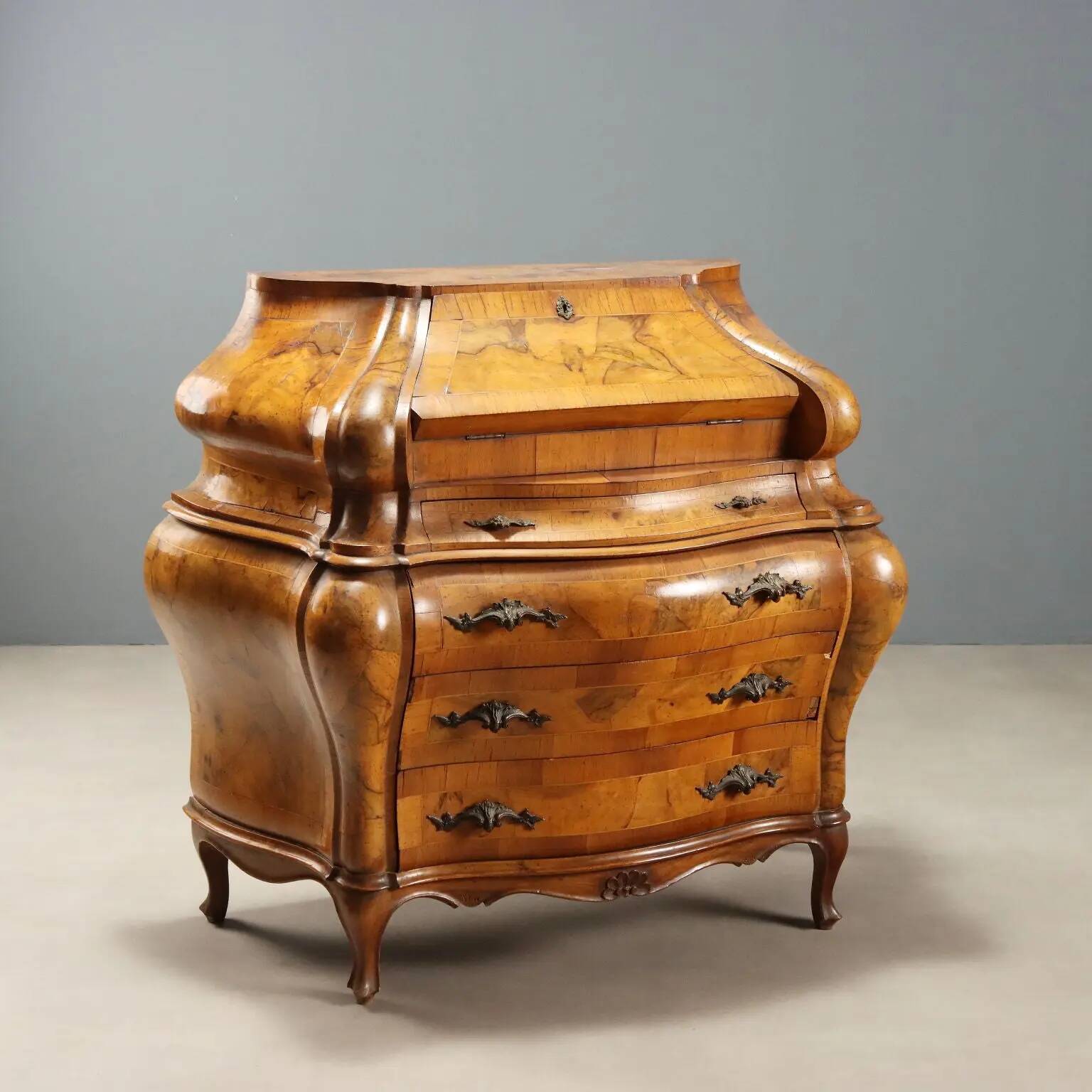 Antique drop-leaf secretary in baroque style made of walnut and maple, 20th century.