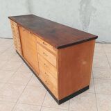 Workshop furniture with drawers and curtain in beech and walnut.