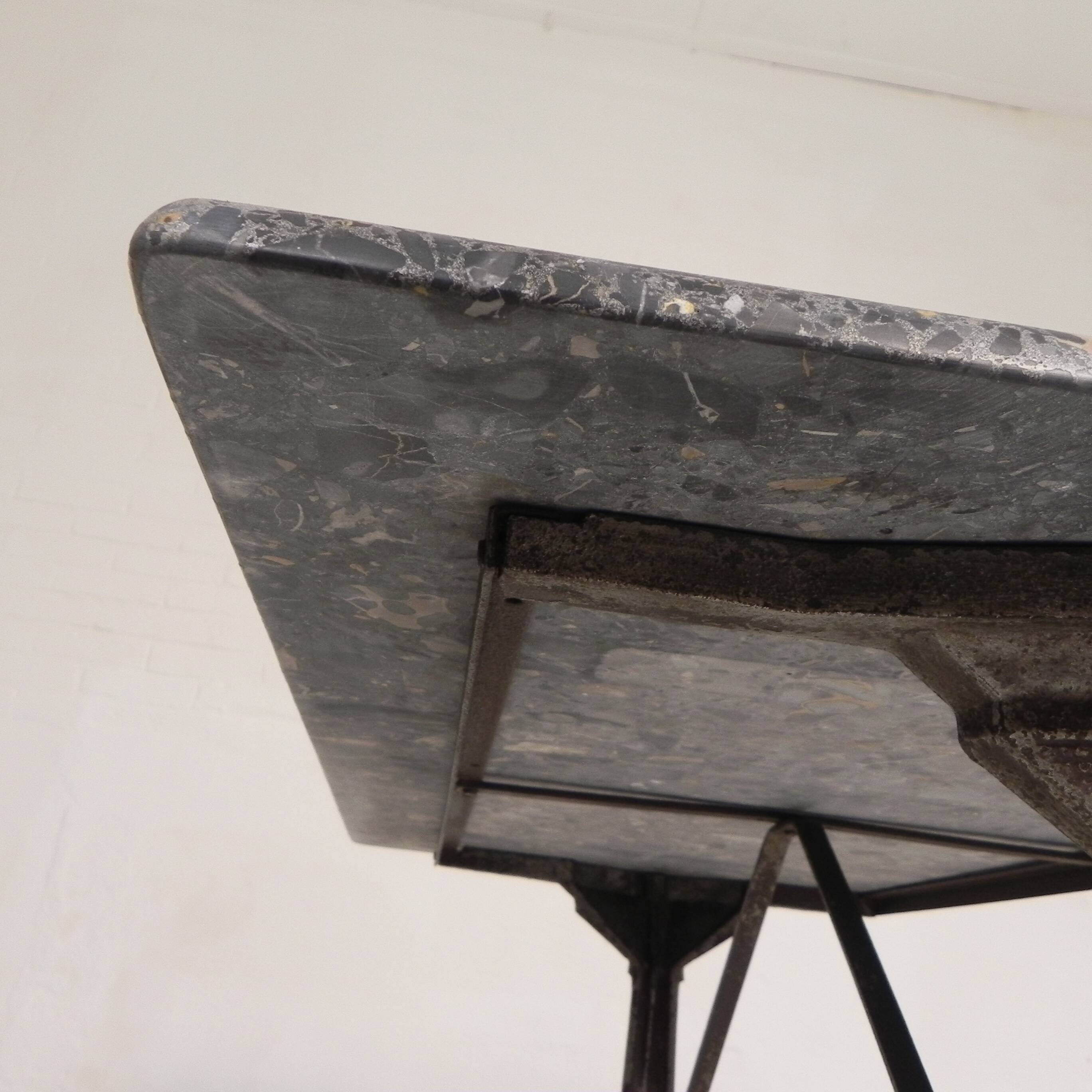 Bistro table with a marble top on a cast iron frame, 1930s.
