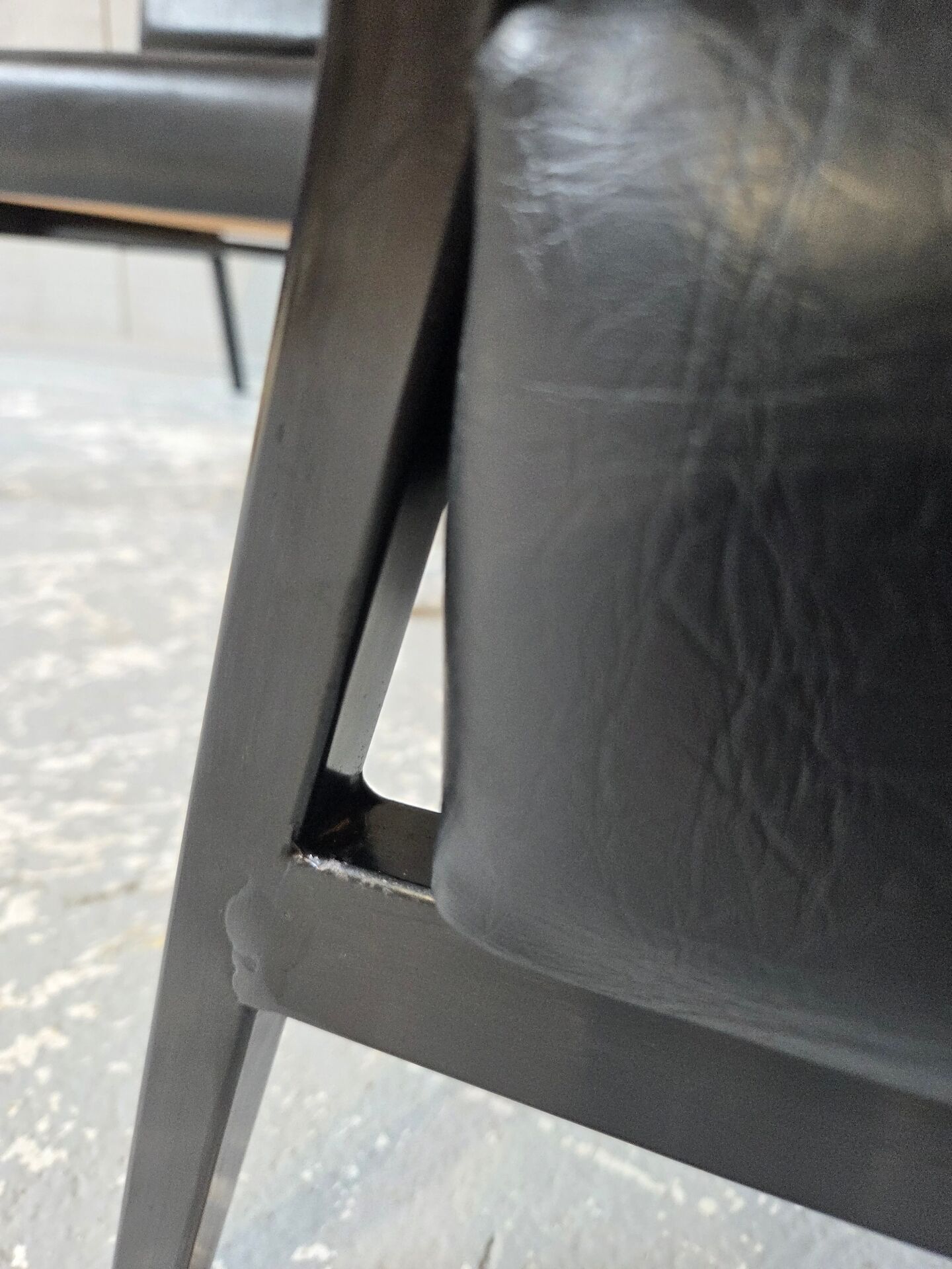 2 faux leather armchairs