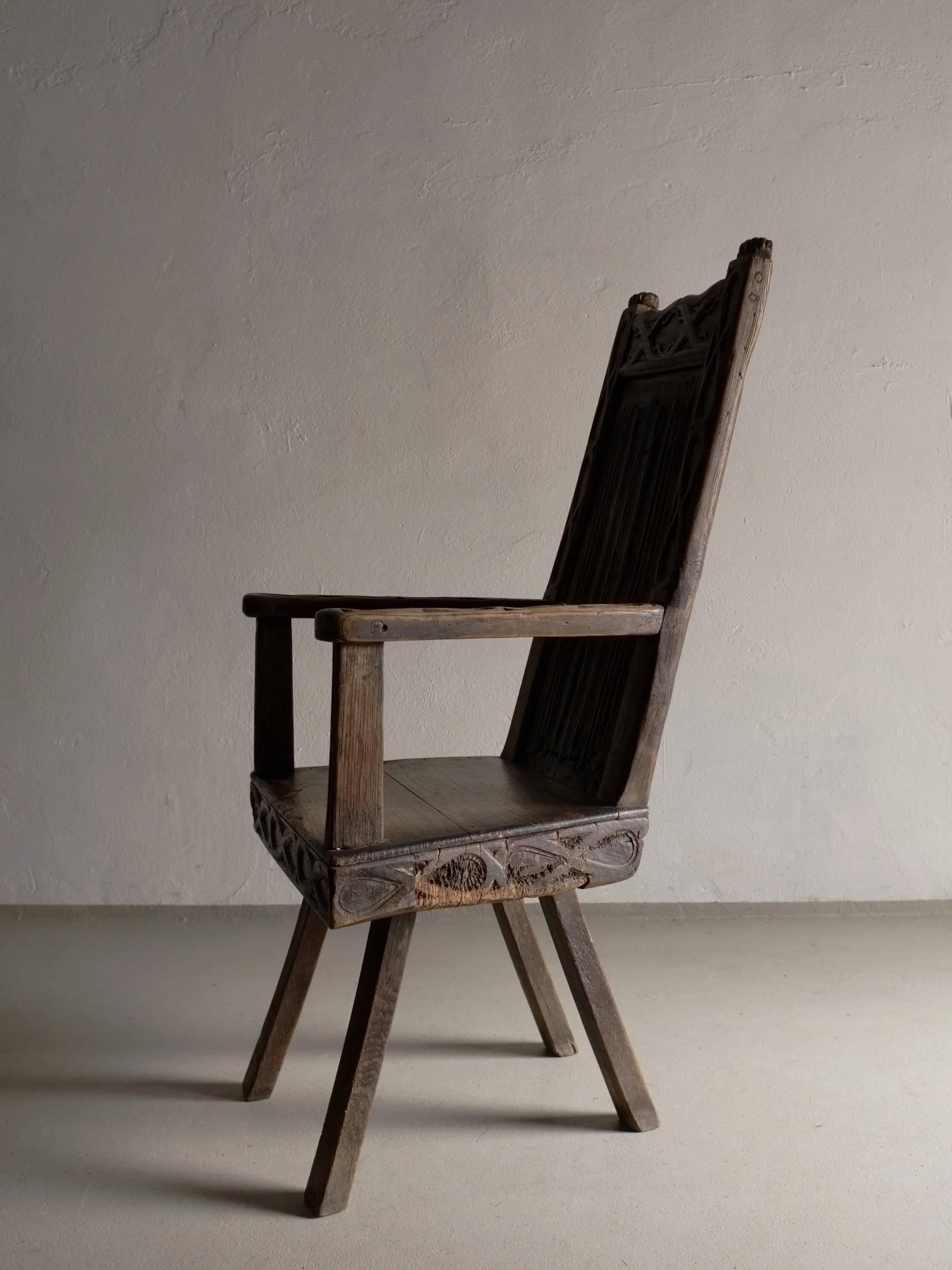 Antique primitive carved oak arm chair, Belgium