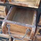 Black metal storage cabinet with 60 wooden drawers