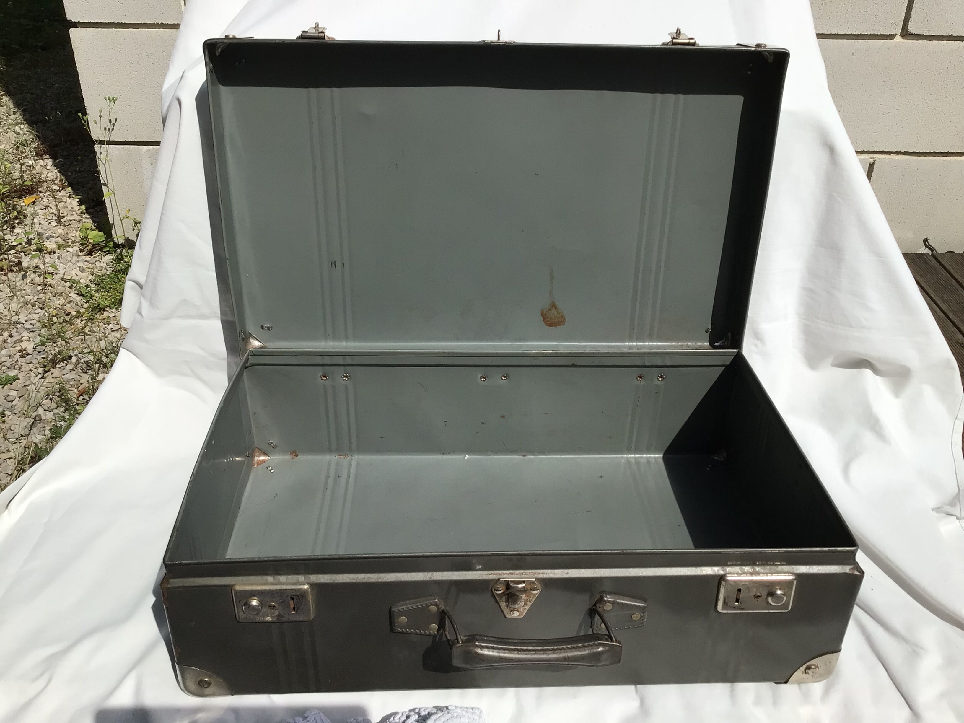 Vintage dark grey metal suitcase