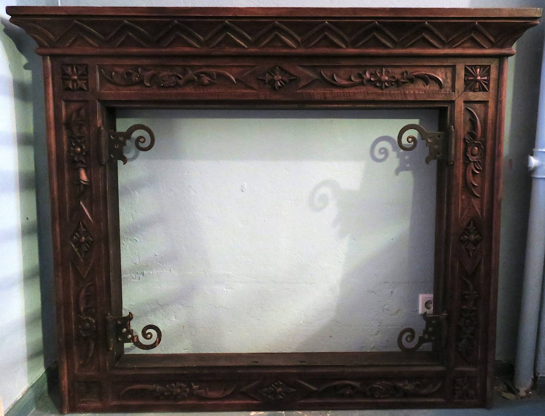 Art deco fireplace in carved solid teak and wrought iron, 1920