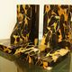 Pair of Portor marble bookends, black and golden yellow