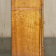 Vintage buffet made of mottled yew wood with three doors and four drawers.