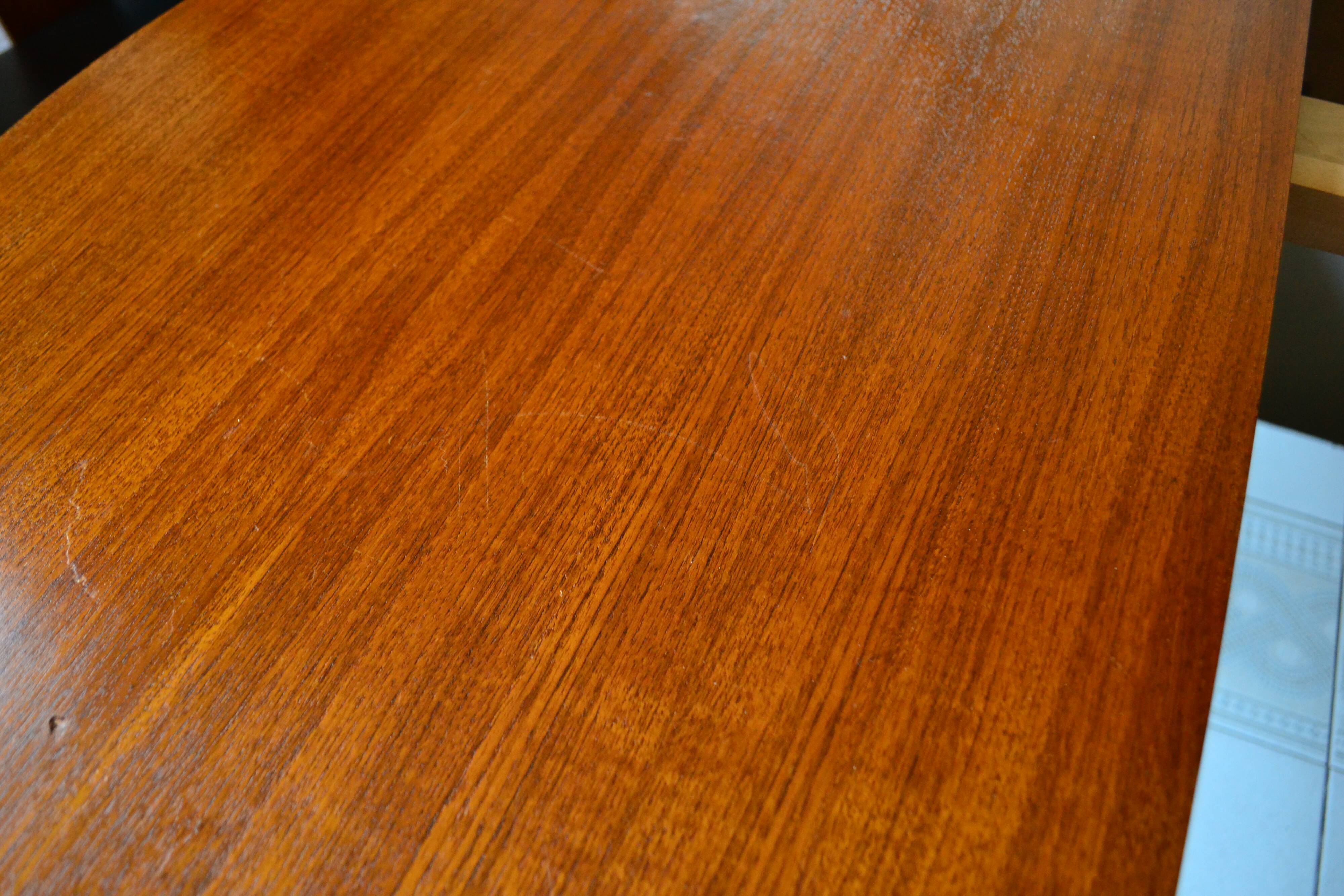 Dining table Pierre Guariche, teak and black steel from the 1960s with extension.