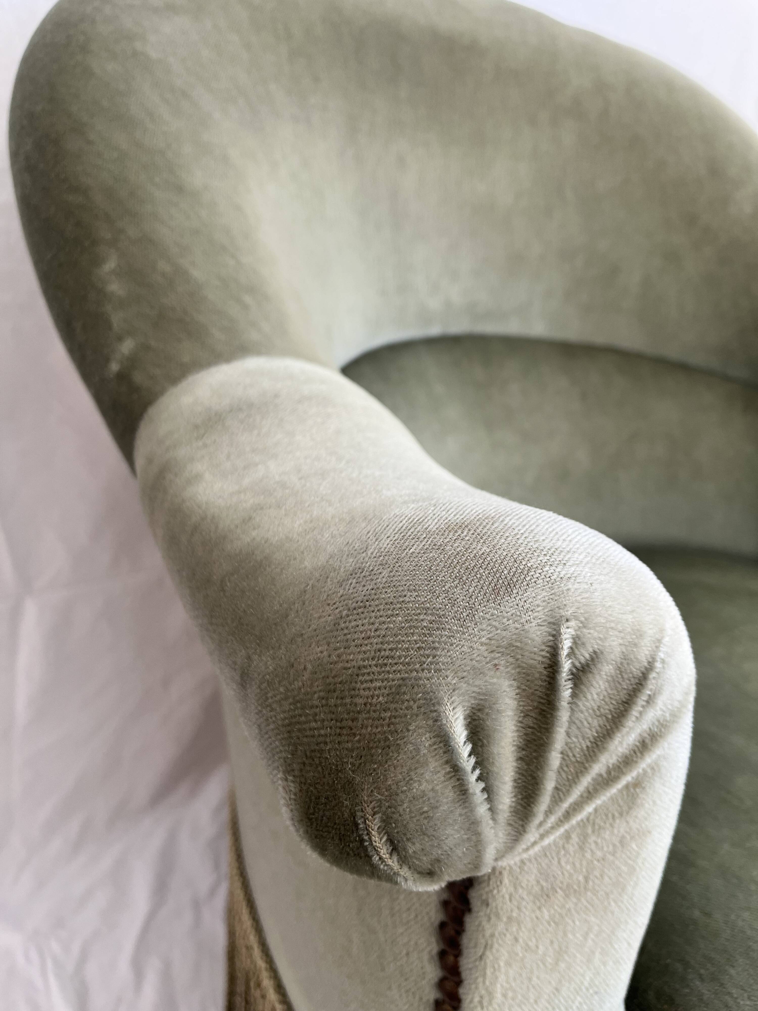 sage green toad armchairs with gold fringe