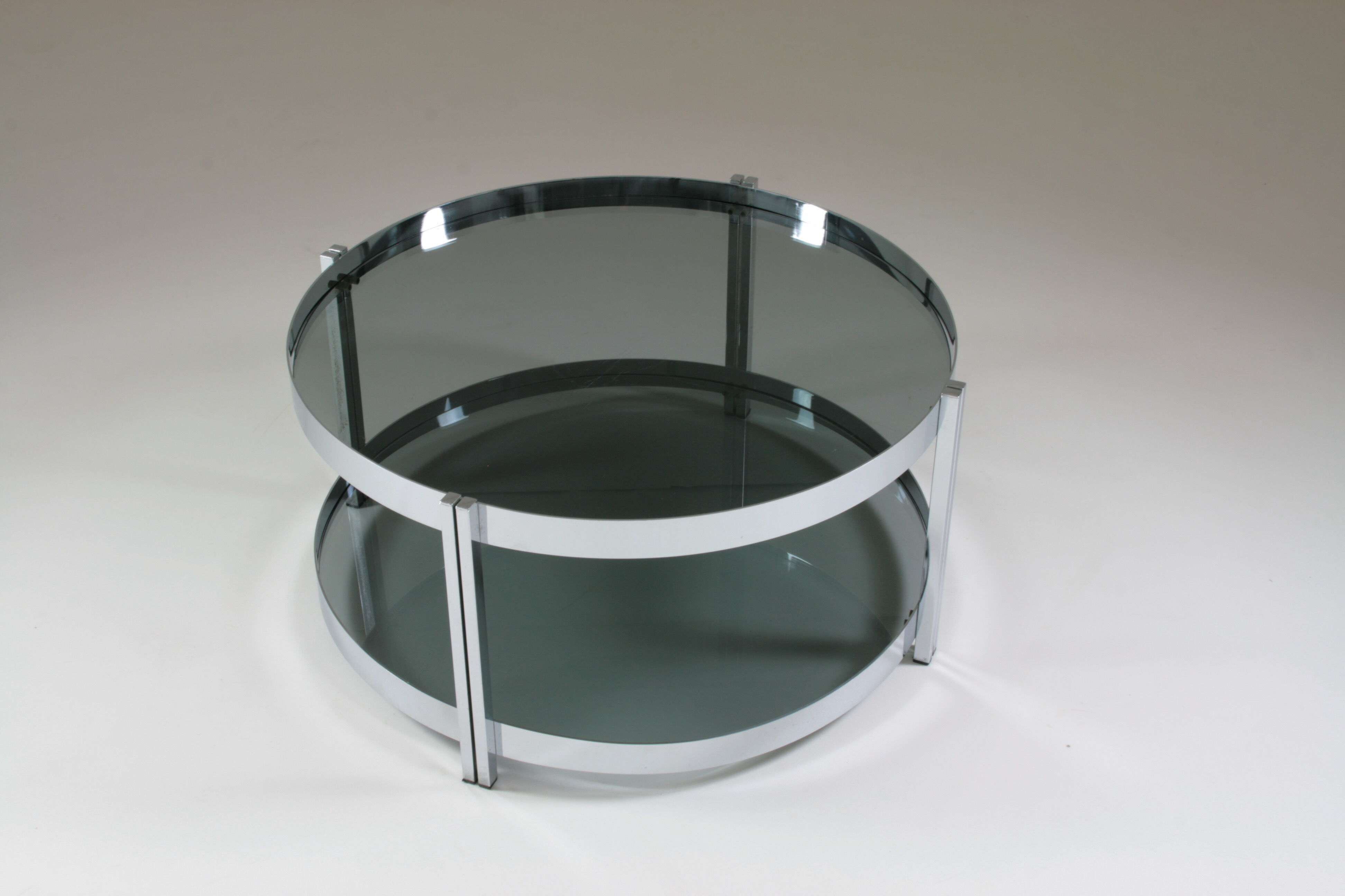 Round chrome-plated metal coffee table and smoked glass tops, France 1970s