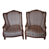 Pair of carved bergere armchairs