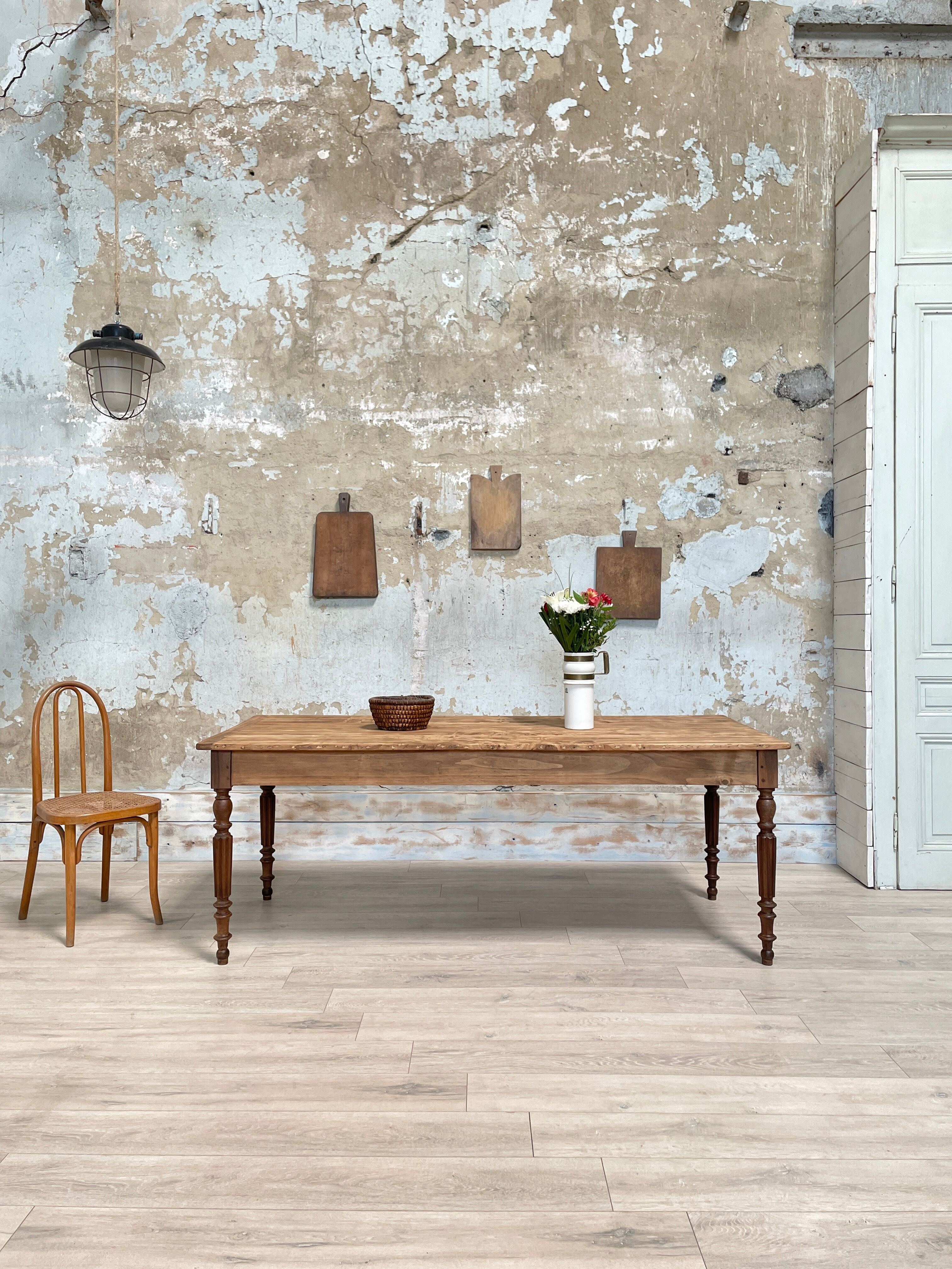 Vintage farmhouse table with turned legs.