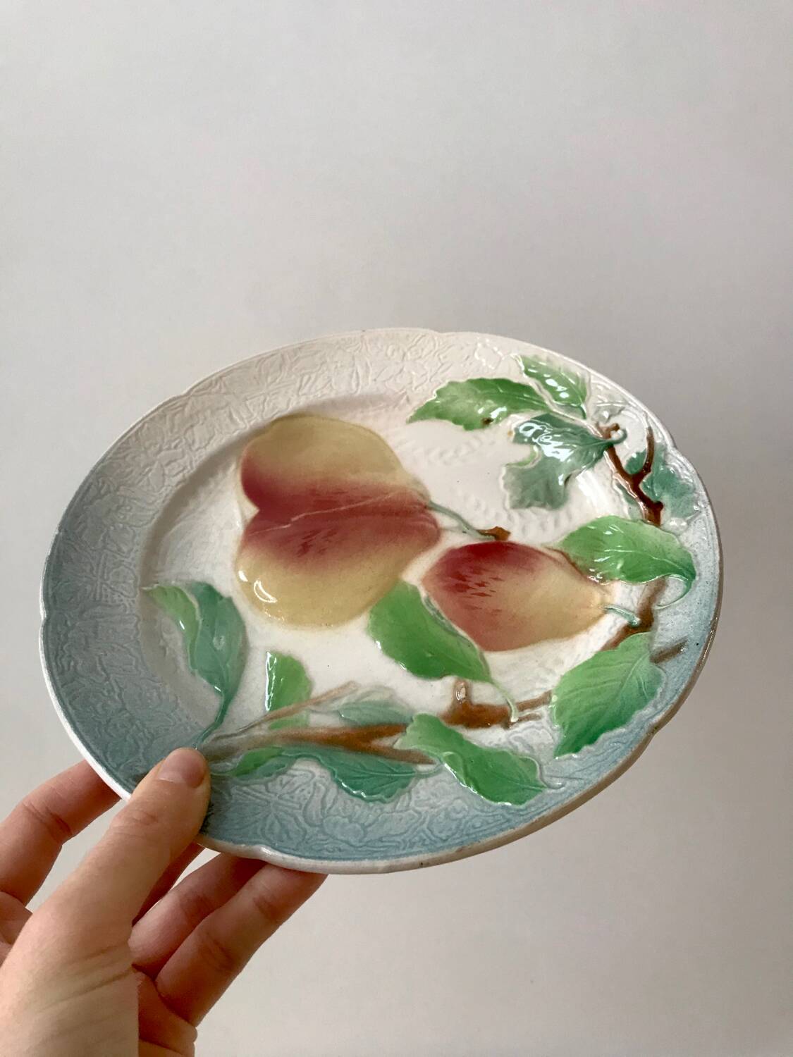 Trio of St Clement dessert plates in 19th century slip