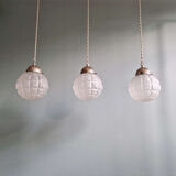 Art Deco trio of frosted glass pendants, 1920s-30s.