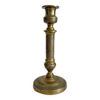 Old candlestick candlestick in vintage decorated brass
