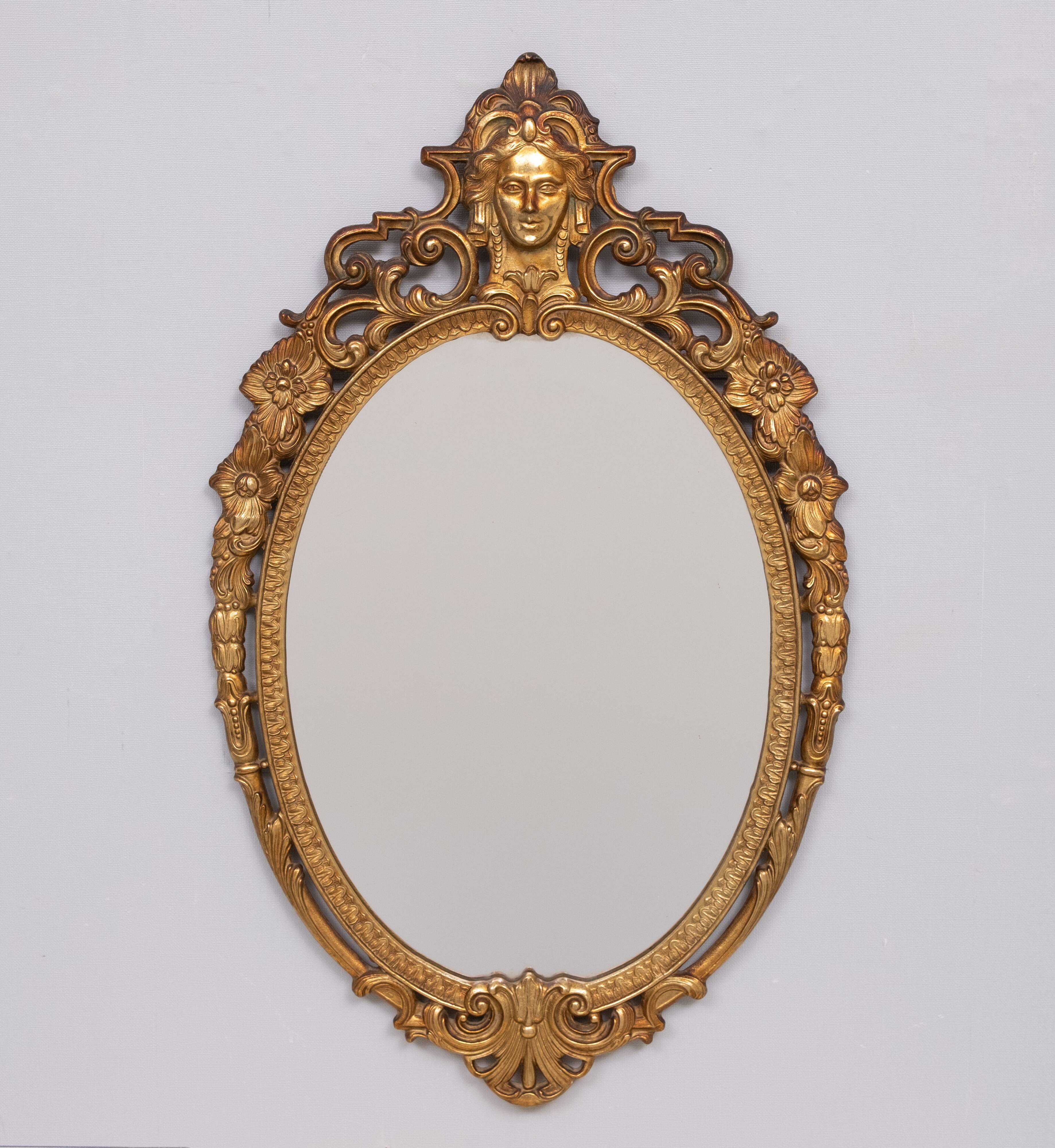 Classic gilded brass console with oval mirror from the 1950s, Italy.