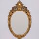 Classic gilded brass console with oval mirror from the 1950s, Italy.