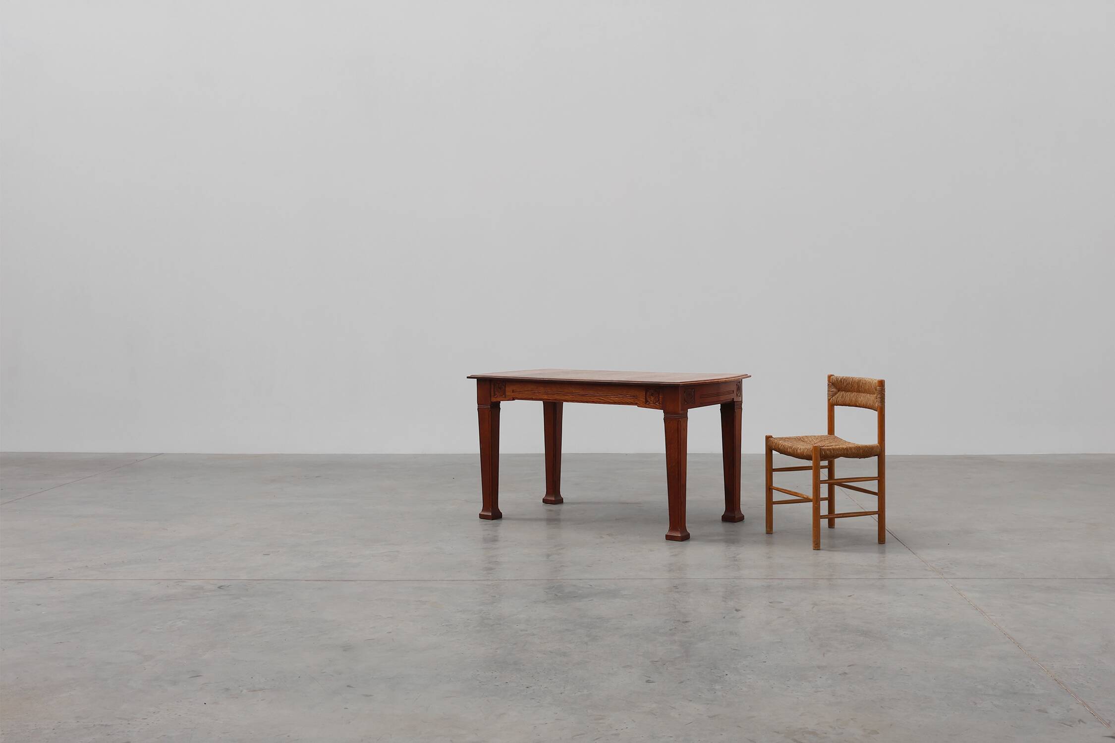 Oak Art Deco dining table with carved frieze, France 1920s