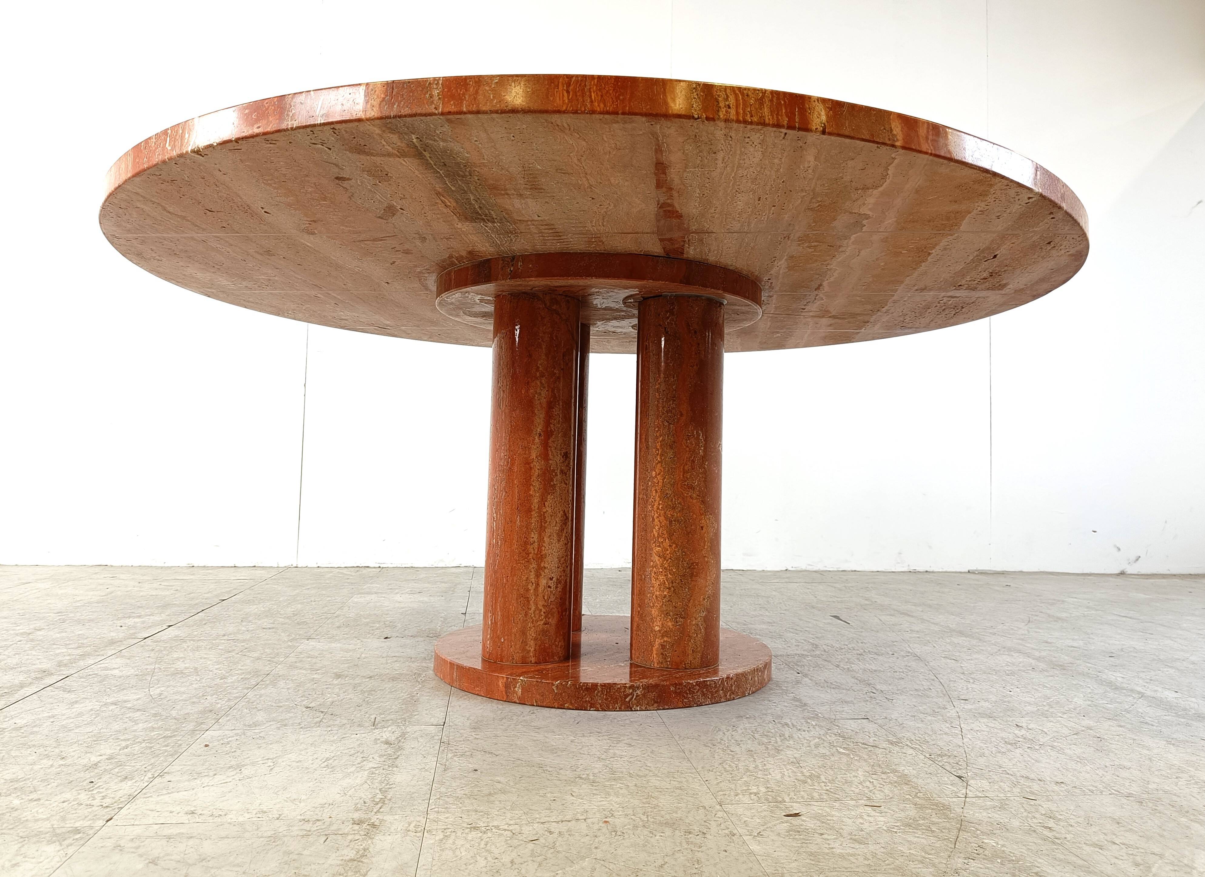 Large round red travertine dining table, 1970s
